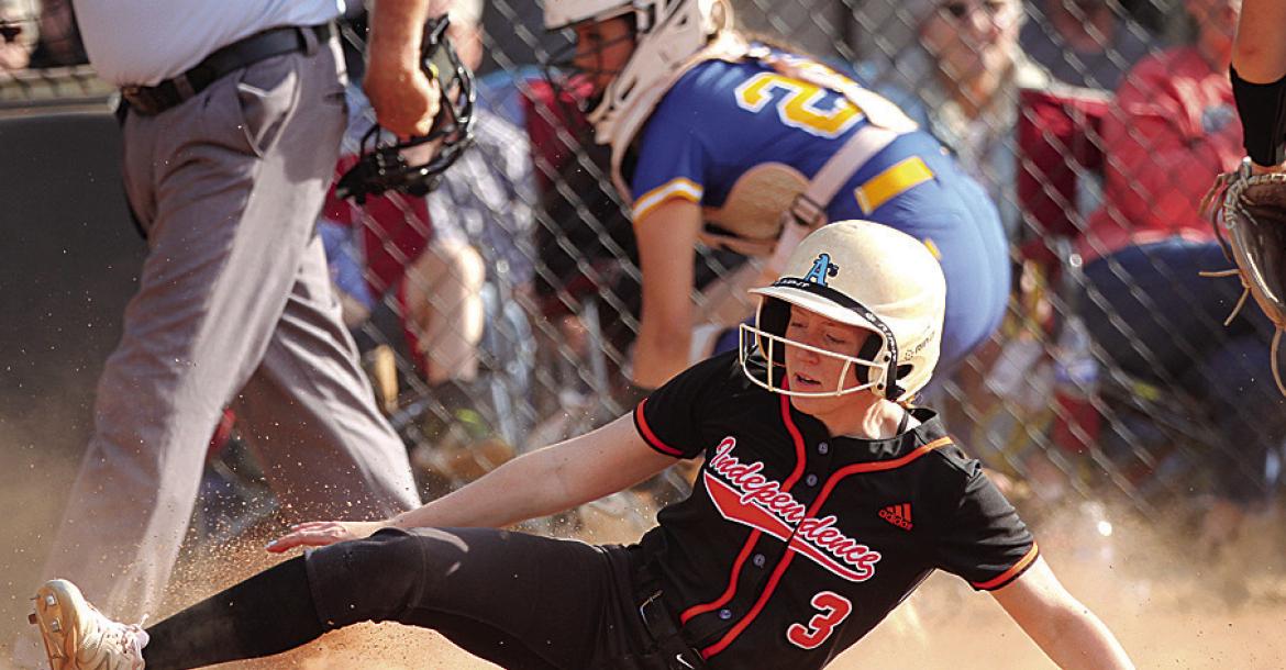 Independence High School sophomore Jaidyn Price slides safely into home plate on a passed ball for the winning run during the sixth inning of the Lady Bulldogs' home victory versus Parsons on Monday, April 22. Nick Dailey | Staff Photo